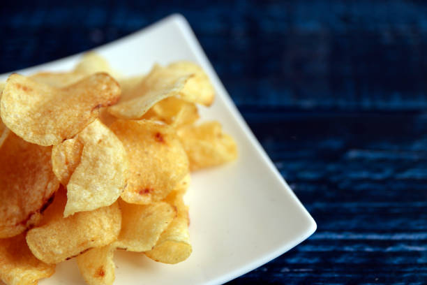 istock Calorie-rich blue table potato chips called mild drugs 1400022074