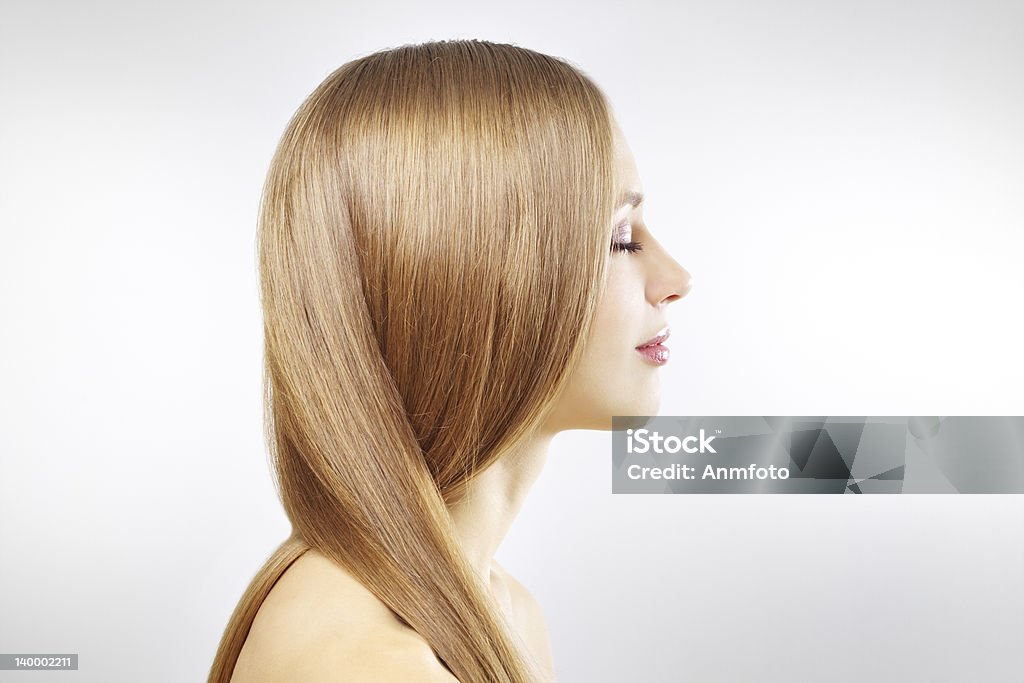 Girl with beautiful straight hair on gray Girl with beautiful straight hair on a gray background Straight Hair Stock Photo