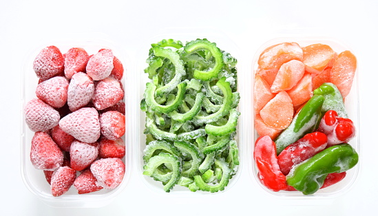 Frozen vegetables in a storage container.