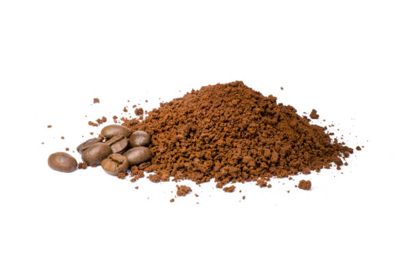 Instant coffee with coffee beans Pile of coffee grind (ground coffee) with coffee beans isolated on white background. instant coffee stock pictures, royalty-free photos & images
