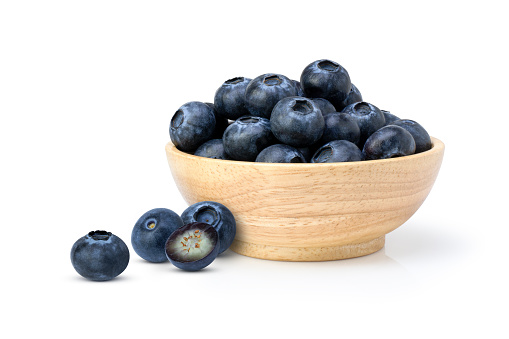 Top view of white bowl full of blueberries