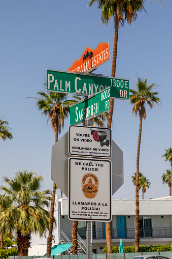 Palm Springs, California, USA - May 03 2022: A sign for Deepwell Estates, Sagebrush and Palm Canyon. Deepwell Estates consists of stylish mid-century-modern, desert ranch, and Spanish-style homes.