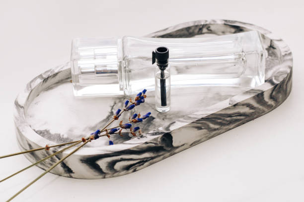 istock Essential oil perfume in a bottle on a decorative stand with lavender 1400026225