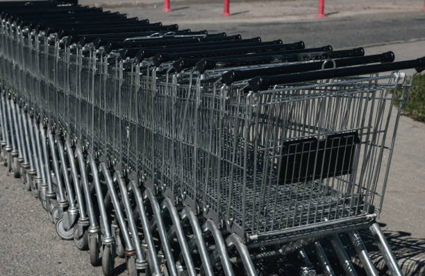 istock shopping carts together in a line up 1400027297