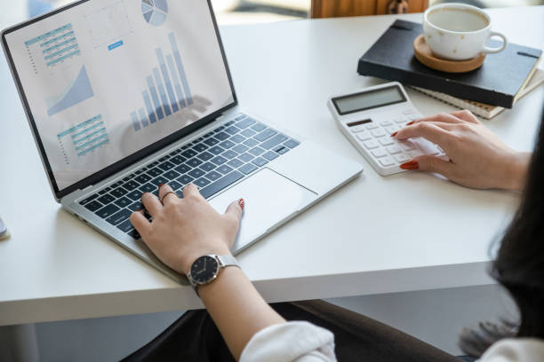 istock data analysis, budget calculation, research, risk management, portrait of Asian women using computers and financial documents in capital planning to increase company profits 1400027744