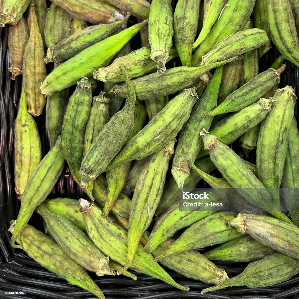 okra gombo raw vrac fruit healthy meal food diet snack on the table copy space food background rustic top view veggie vegan or vegetarian food okra gombo raw vrac fruit healthy meal food diet snack on the table copy space food background rustic top view Agriculture Stock Photo