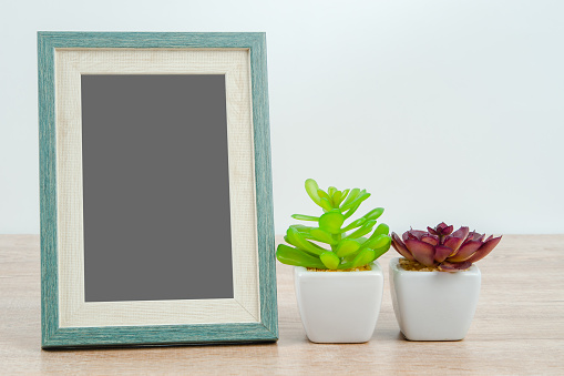 Picture Frame on wooden texture background.