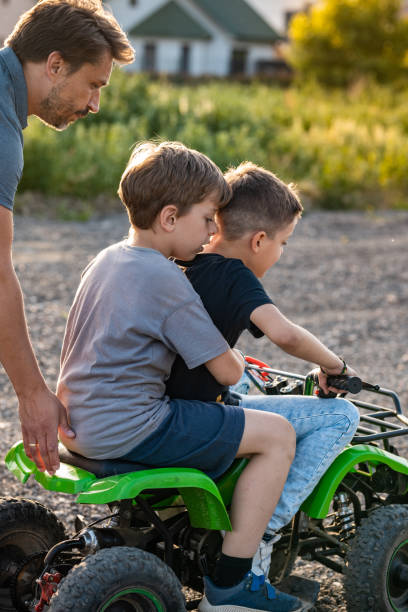istock Kids riding their quad motor 1400032528