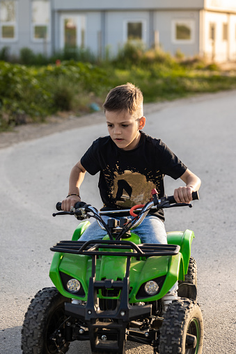 Boy riding quad motor