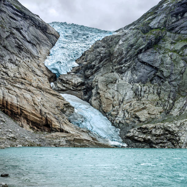 Melting ice mountain landscape, Norway. Briksdal glacier in Jostedalsbreen national park. Global warming concept.