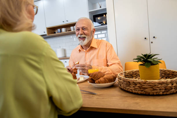 istock Senior couple eating breakfast at home. 1400038447