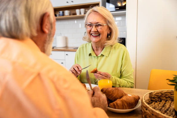istock Senior couple eating breakfast at home. 1400039359
