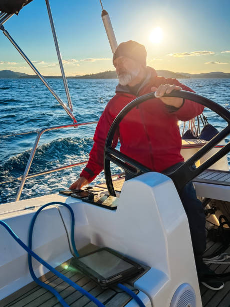 istock Skipper sailing on sailboat 1400040509