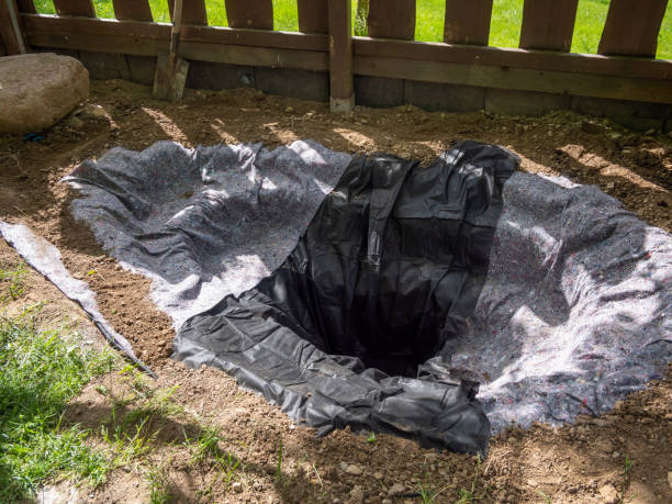 Fleece is laid out in the garden pond construction Fleece is laid out in the garden pond construction water garden stock pictures, royalty-free photos & images