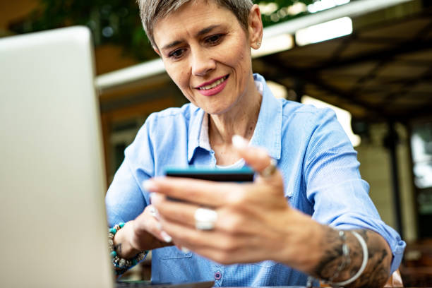 istock Mature woman is purchasing online 1400044669