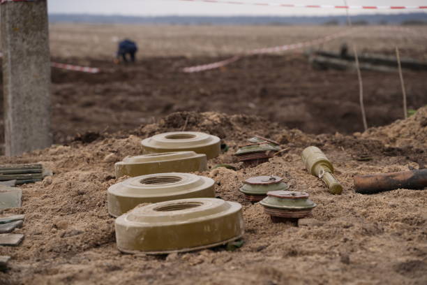 Demining by troops of the territory Demining by troops of the territory. Many mines, shells, artillery, grenades, fragmentation grenades land mine stock pictures, royalty-free photos & images