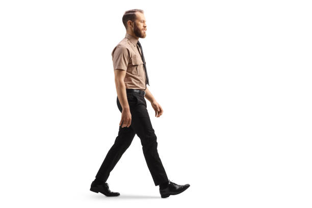 istock Full length profile shot of a security officer walking 1400047642