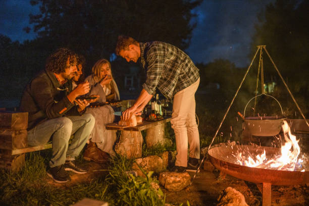 istock Mixed Race Friends Camping Together In Nature 1400047743