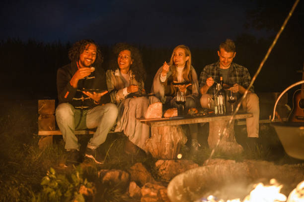 istock Mixed Race Friends Camping Together In Nature 1400047745