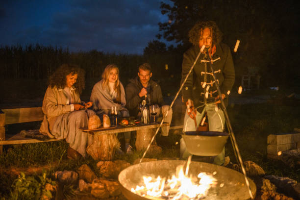 istock Mixed Race Friends Camping Together In Nature 1400047746