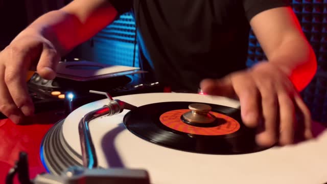 DJ playing music from 7 inch record