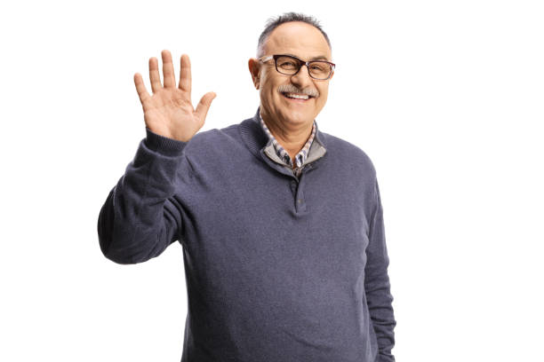 Smiling casual mature man waving
