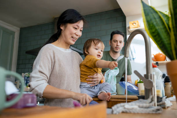 istock Cleaning Up with Mummy and Daddy 1400051605