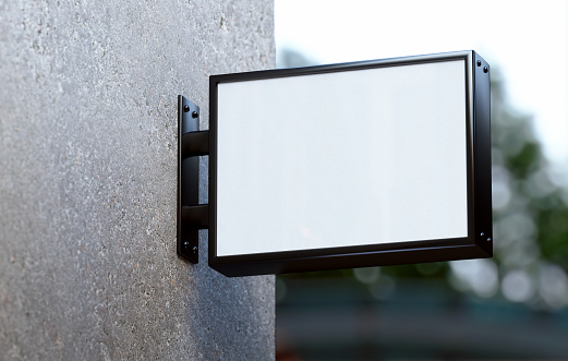 Blank wall sign mockup hung on a store facade. Rectangular outdoor business signage template for branding in realistic 3D rendering