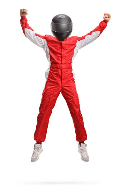 retrato de cuerpo entero de un corredor de coches con un casco saltando y gesticulando felicidad - helmet crash helmet motorized sport auto racing fotografías e imágenes de stock