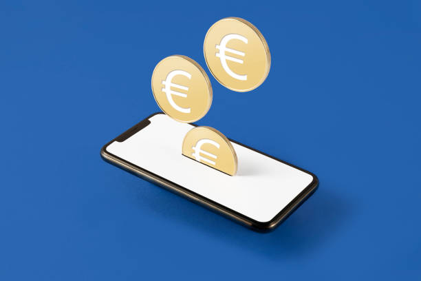 Mobile Payment Concept Coins with Euro symbol and mobile phone which symbolize online payment and savings on blue background hhh stock pictures, royalty-free photos & images
