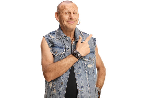 istock Cheerful bald man in a denim vest pointing 1400054161