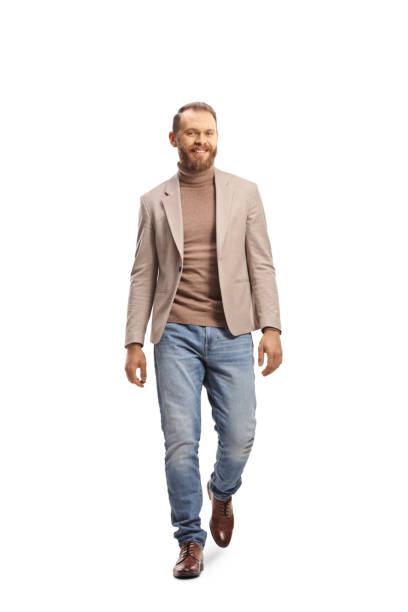 istock Fair haired young man walking towards camera and smiling 1400054502