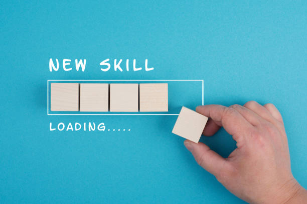 Progress bar with the words new skill loading, education concept, having a goal, online learning, knowledge is power strategy stock photo