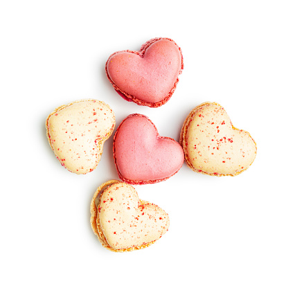 Heart shaped Sweet macarons isolated on a white background.