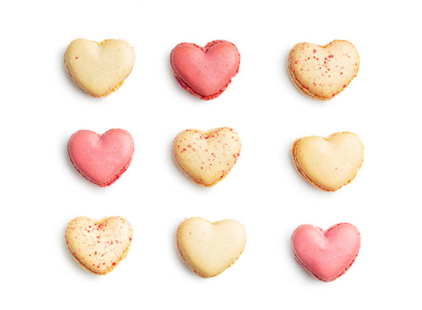 istock Heart shaped Sweet macarons isolated on white background. 1400059729