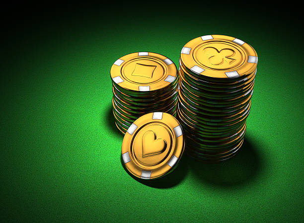 istock Small group of gold poker chips on green 140006052