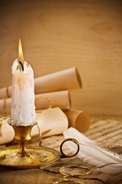 istock old candle on table with rolls of paper 140006061