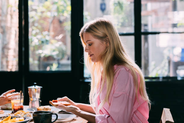 istock Blonde Woman Having Breakfast At Home 1400060697