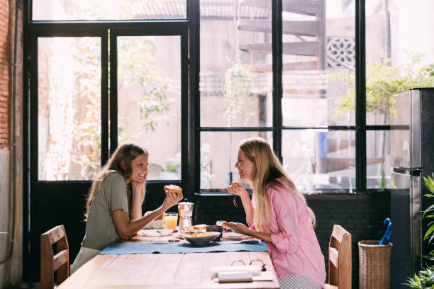istock Mother And Daughter Eating Their Breakfast At Home 1400060821