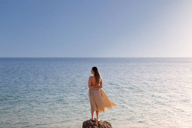 istock Woman facing the horizon looking left 1400061779