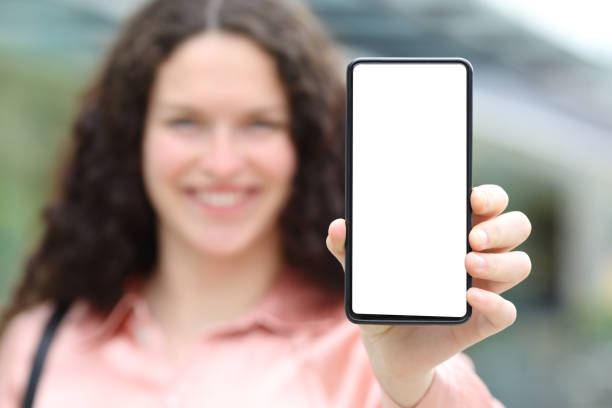 istock Happy elegant woman showing blank phone screen 1400065669
