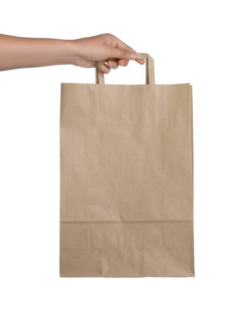istock Woman with paper bag on white background, closeup 1400065794