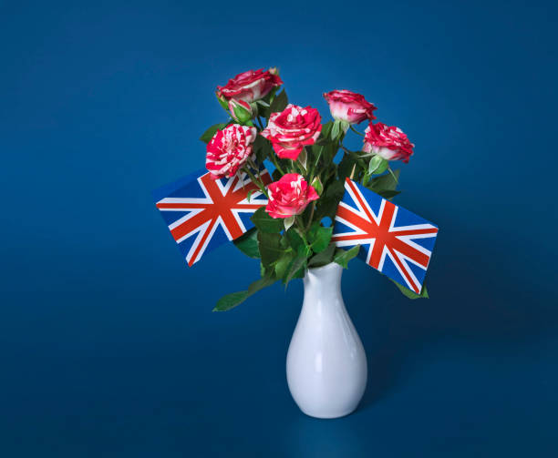 istock vase with roses and british flags on a dark blue background 1400067094