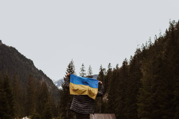 istock Man holding Ukrainian flag on his back 1400067687