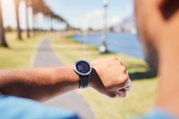 istock Closeup of unknown fit active mixed race man using a smartwatch to time a workout and check his heart rate after training outdoors alone. Muscular hispanic athlete monitoring calories during exercise 1400069124