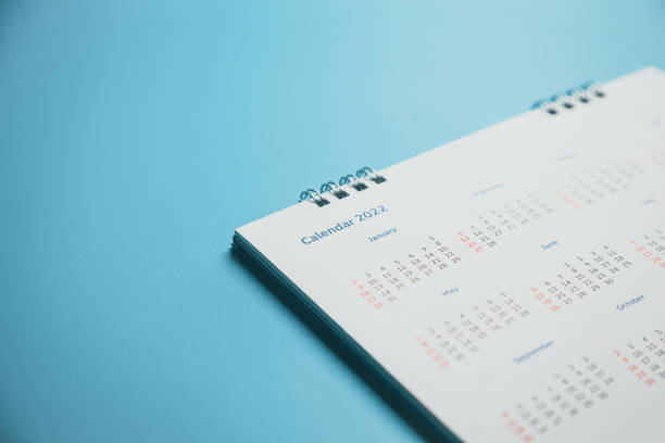 istock Close top view on white calendar 2022 month schedule Work planning and life concept. 1400070574
