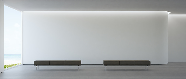 Empty gray floor living room with white concrete wall background.