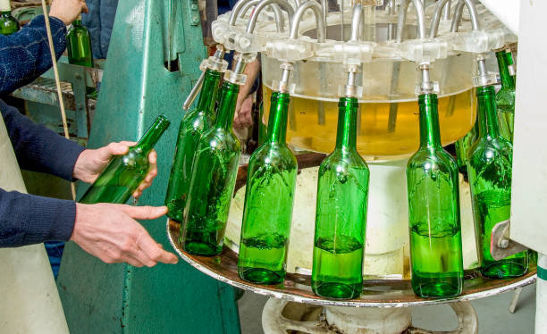 istock Bottling and seaaling conveyor line at winery. 1400070690