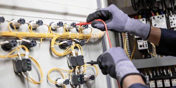 istock Electrician engineer tests electrical installations and wires on relay protection system. Adjustment of scheme of automation and control of electrical equipment. 1400070823