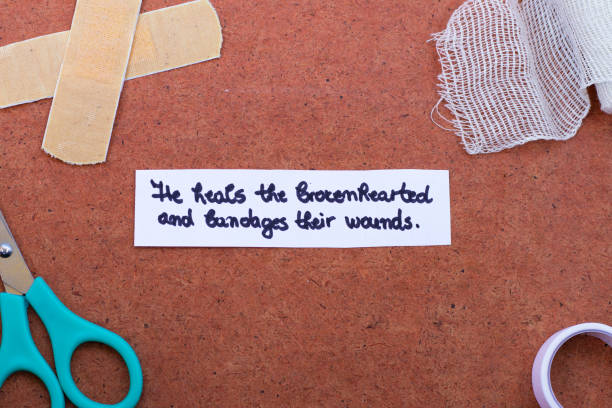 istock God heals the brokenhearted and bandages their wounds, a handwritten text note on a textured background with medical accessories 1400071085